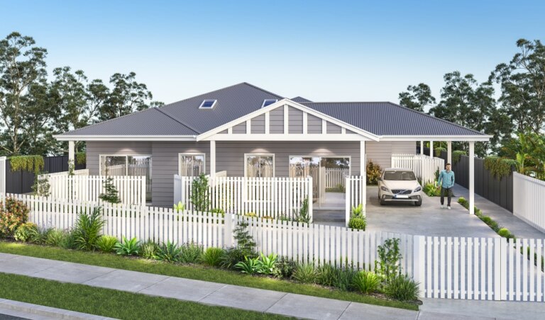 A modern single-story house with a gray exterior, white picket fence, attached garage, driveway, and surrounding greenery in the serene neighborhood of Wamberal. A person stands near a parked car in the driveway.