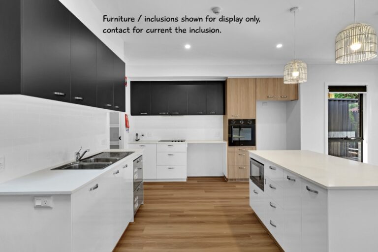 Modern kitchen interior with white countertops, wooden floors, black and white cabinetry, a built-in oven, and pendant lighting. Note indicates furniture and inclusions are for display only. Perfectly located in the vibrant Concord area of Inner West Sydney.