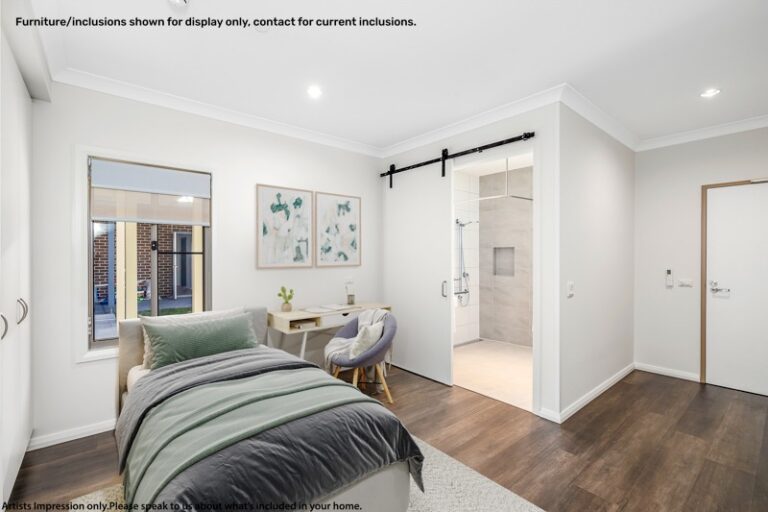 A bedroom in Narraweena, Northern Beaches with a single bed, desk, and chair. A sliding barn door leads to an ensuite bathroom. Text on the image advises that furniture/inclusions are for display purposes only.